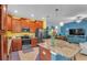 Open concept kitchen with stainless steel appliances and a large granite island at 6435 Sedgeford Dr, Lakeland, FL 33811