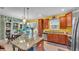 Bright kitchen with a large island, stainless appliances, and cheerful decor at 6435 Sedgeford Dr, Lakeland, FL 33811