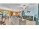 Open-concept living room with tile floors and comfortable seating arrangements at 6435 Sedgeford Dr, Lakeland, FL 33811