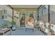 Cozy patio with a unique egg chair, a plant stand, and a view of the backyard at 6435 Sedgeford Dr, Lakeland, FL 33811