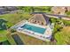 Aerial view of community pool surrounded by chairs and manicured lawns at 6435 Sedgeford Dr, Lakeland, FL 33811