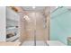 Beautiful glass enclosed walk-in shower with tile surround and built in shelves at 6435 Sedgeford Dr, Lakeland, FL 33811
