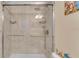 Gorgeous walk-in shower with a rainfall shower head, grab bar, and built in shelves at 6435 Sedgeford Dr, Lakeland, FL 33811