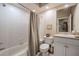 Clean bathroom with a shower-tub combo and a vanity with a large mirror at 645 Whisper Woods Dr, Lakeland, FL 33813