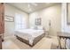 Serene bedroom with plantation shutters, neutral walls, and comfortable furnishings at 645 Whisper Woods Dr, Lakeland, FL 33813