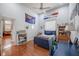 Bedroom with high ceilings, a ceiling fan, wood floors, and a connecting door at 645 Whisper Woods Dr, Lakeland, FL 33813