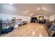 A large bonus room with a TV, workout equipment, storage, and wood floors at 645 Whisper Woods Dr, Lakeland, FL 33813