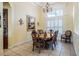 Inviting dining room with wood table and chairs beneath a decorative chandelier, creating an elegant space at 645 Whisper Woods Dr, Lakeland, FL 33813