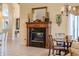 Cozy dining area featuring a fireplace and traditional decor, perfect for intimate gatherings at 645 Whisper Woods Dr, Lakeland, FL 33813