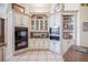 Custom kitchen with granite countertops, stainless steel appliances, and beautiful cabinetry at 645 Whisper Woods Dr, Lakeland, FL 33813