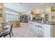 An open floor plan seamlessly connects the living room and kitchen, perfect for entertaining at 645 Whisper Woods Dr, Lakeland, FL 33813
