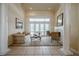 Bright living room featuring French doors, fireplace, and comfortable seating area at 645 Whisper Woods Dr, Lakeland, FL 33813