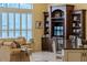 Living area with built-in shelving, comfortable seating, and natural light at 645 Whisper Woods Dr, Lakeland, FL 33813