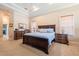 Relaxing bedroom with a plush bed, neutral tones, and ambient lighting from bedside lamps, perfect for unwinding at 645 Whisper Woods Dr, Lakeland, FL 33813