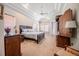 Comfortable bedroom with a large bed, soft lighting from lamps, and beautiful ceiling trim detail at 645 Whisper Woods Dr, Lakeland, FL 33813