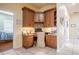 Office nook with custom cabinetry, built-in desk, and neutral tile flooring at 645 Whisper Woods Dr, Lakeland, FL 33813