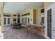 Inviting outdoor bar area with ample seating, perfect for socializing and enjoying the poolside at 645 Whisper Woods Dr, Lakeland, FL 33813