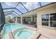 Amazing pool and hot tub with ample outdoor seating for relaxation and entertainment at 645 Whisper Woods Dr, Lakeland, FL 33813