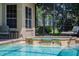 Relaxing spa and pool area with comfortable outdoor seating, great for leisure and sunshine at 645 Whisper Woods Dr, Lakeland, FL 33813