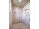 Walk-in shower with neutral tile, built-in niche, and a clear glass enclosure for a modern and clean aesthetic at 645 Whisper Woods Dr, Lakeland, FL 33813
