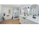 Stylish bathroom with a freestanding tub, glass enclosed shower, and double vanity sinks at 6527 Fernwood Dr, Lakeland, FL 33810