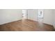 Spacious bedroom with updated floors leads to ensuite with dual closets for optimal storage at 6527 Fernwood Dr, Lakeland, FL 33810