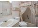 Well-lit bathroom with a shower-tub combo and vanity, offering functionality and comfort at 6731 Canterbury Ne Dr, Winter Haven, FL 33881