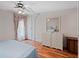 Charming bedroom with two dressers and wood-look floors, creating a cozy retreat at 6731 Canterbury Ne Dr, Winter Haven, FL 33881