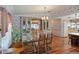 Cozy dining area with a chandelier and access to the kitchen at 6731 Canterbury Ne Dr, Winter Haven, FL 33881