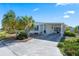 Inviting home with a carport and attractive landscaping in front at 6731 Canterbury Ne Dr, Winter Haven, FL 33881