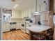 Well-maintained kitchen with white cabinets, modern appliances, and tile countertops at 6731 Canterbury Ne Dr, Winter Haven, FL 33881