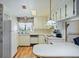 Functional kitchen features white appliances, ample cabinet space, and a breakfast bar at 6731 Canterbury Ne Dr, Winter Haven, FL 33881