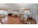 Bright living room featuring hardwood floors and floral wallpaper at 6731 Canterbury Ne Dr, Winter Haven, FL 33881