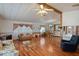 Open concept living room flows into a dining area, with wood flooring at 6731 Canterbury Ne Dr, Winter Haven, FL 33881
