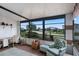 Inviting sunroom with large windows and a desk space, offering a relaxing atmosphere at 6731 Canterbury Ne Dr, Winter Haven, FL 33881