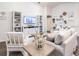 Well-lit living room with comfortable seating, stylish decor, and a modern entertainment setup at 702 Bentley North Loop, Auburndale, FL 33823