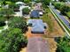 An aerial view of a well-maintained home with a spacious backyard and mature trees at 790 Chelsea Way, Lake Wales, FL 33853