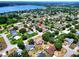 An aerial view showcases the property's location within a picturesque neighborhood with lake views at 790 Chelsea Way, Lake Wales, FL 33853