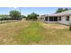 Spacious backyard with room to relax and entertain featuring green grass and a privacy fence at 790 Chelsea Way, Lake Wales, FL 33853