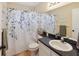 Bathroom featuring a shower with a decorative shower curtain, tile flooring, and vanity at 790 Chelsea Way, Lake Wales, FL 33853