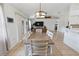 View of the dining room with an open floor plan that flows into the living room with vaulted ceiling at 790 Chelsea Way, Lake Wales, FL 33853