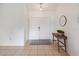 Bright foyer featuring double doors, neutral tile flooring, modern decor, and plenty of space at 790 Chelsea Way, Lake Wales, FL 33853