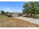 A single-story home with a two-car garage, located in a peaceful neighborhood at 790 Chelsea Way, Lake Wales, FL 33853