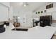 The kitchen boasts white cabinets, a black refrigerator, modern countertops, and a stylish gold faucet at 790 Chelsea Way, Lake Wales, FL 33853