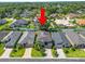 Aerial view of a home nestled in a community with lush greenery and well-maintained properties at 843 Christina Chase Dr, Lakeland, FL 33813