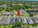 Aerial shot of a residential home surrounded by green trees, lawns, and neighborhood homes at 843 Christina Chase Dr, Lakeland, FL 33813