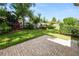 Well-manicured backyard featuring a lush lawn, colorful landscaping, and a privacy fence at 843 Christina Chase Dr, Lakeland, FL 33813