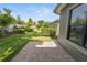 Beautiful backyard with brick patio, lush lawn, and manicured landscaping, perfect for outdoor enjoyment at 843 Christina Chase Dr, Lakeland, FL 33813