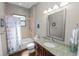 Charming bathroom features granite countertop, tub, and soft lighting at 843 Christina Chase Dr, Lakeland, FL 33813