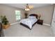 Cozy bedroom with ceiling fan and natural light from the window at 843 Christina Chase Dr, Lakeland, FL 33813